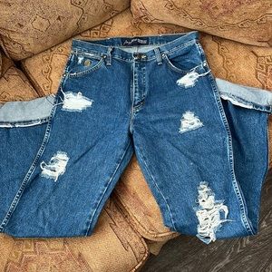 Distressed cowboy cut wranglers